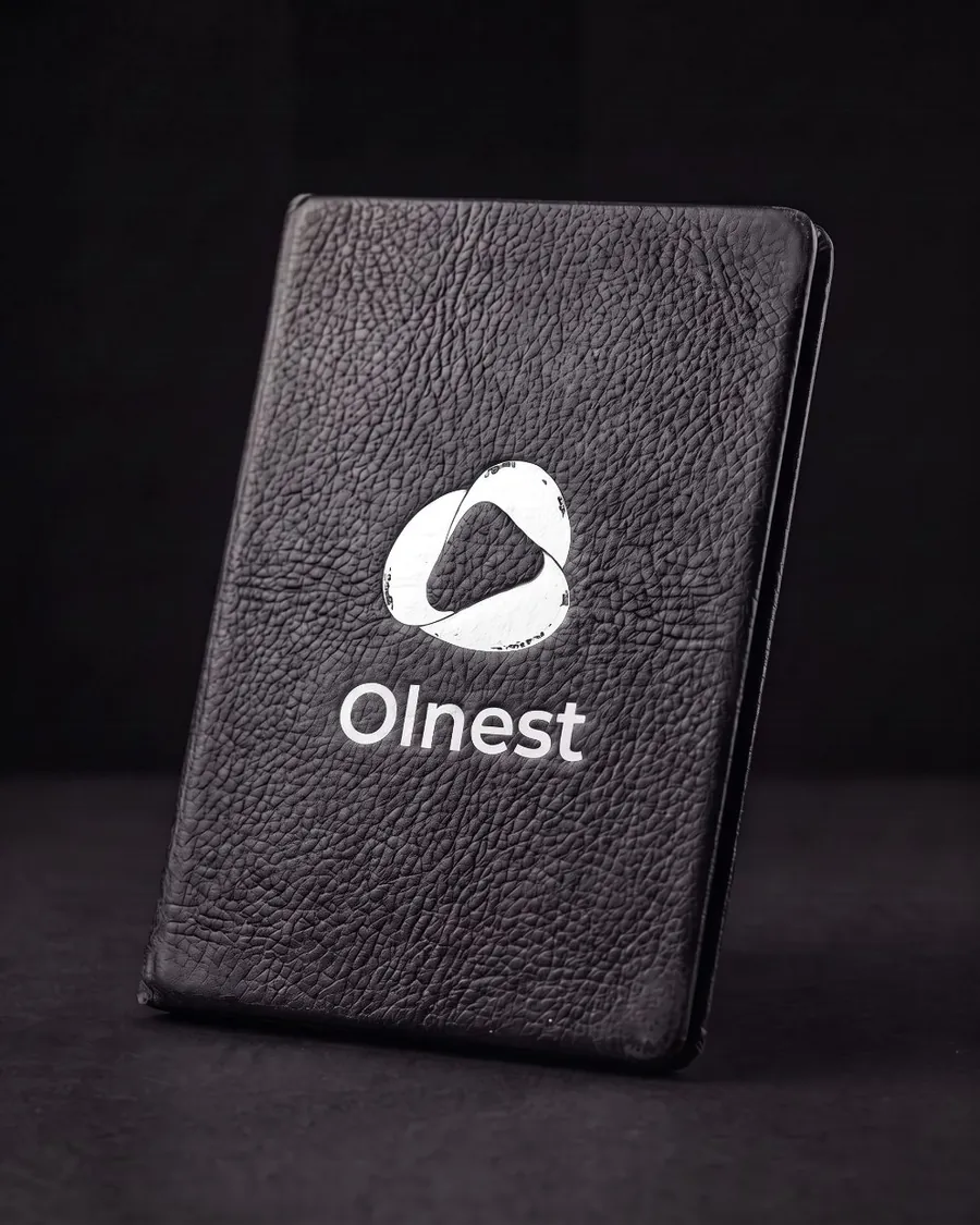 Olnest Founder Passport, a black leather cover